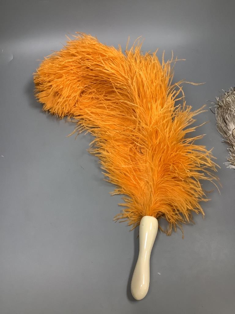 A collection of four various feather fans